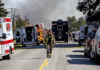 How the mass shooting and a devastating fire unfolded at a Michigan church Firefighter walks down the street