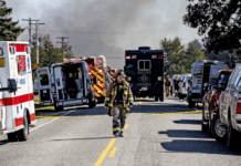 How the mass shooting and a devastating fire unfolded at a Michigan church Firefighter walks down the street